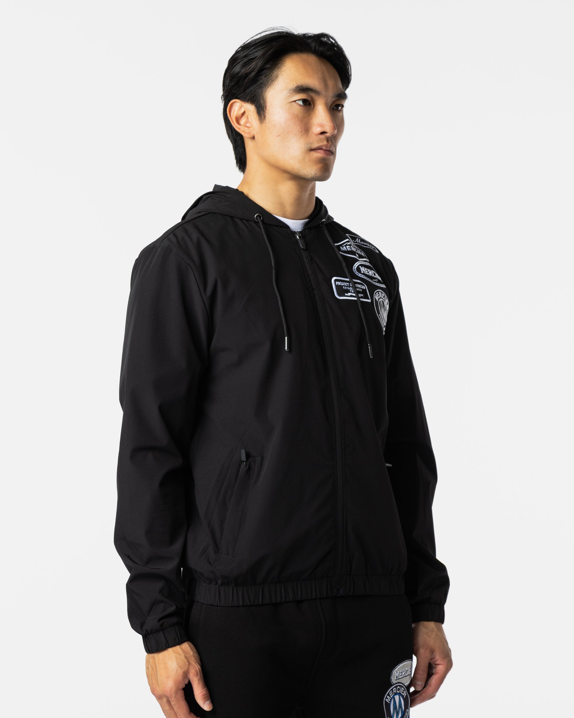 monochrome BTS＊WIND JACKET Mercier Men's Mono Badge Windbreaker - Black | Men's Jackets