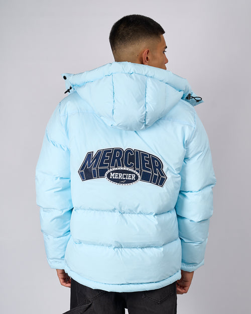 Seaicéad Puffer Court Mercier Gorm Spéir