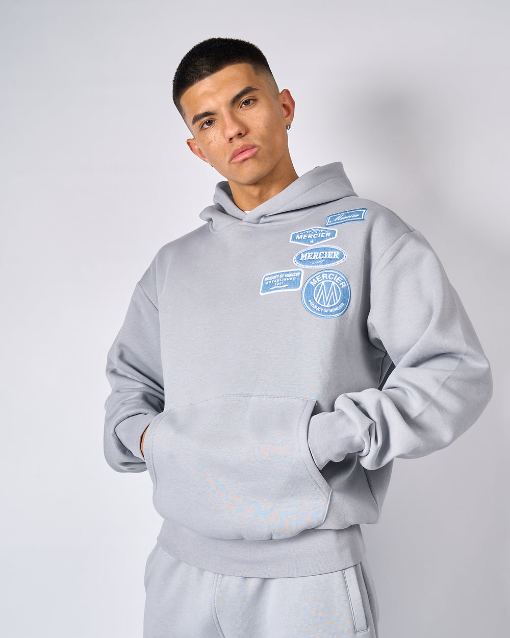 Mercier Men s OG Badge Hoodie Smoke Grey Denim Men s Hoodies MERCIER mercier-men-s-og-badge-hoodie-smoke-grey-denim-men-s-hoodies-mercier