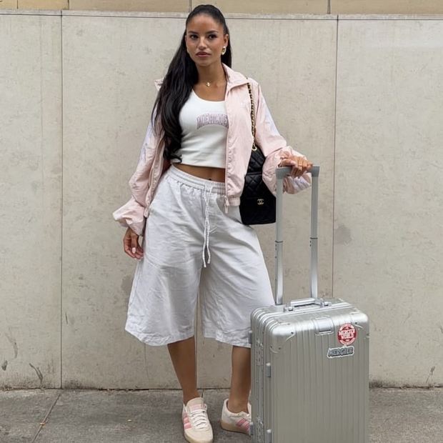 Community fit: pink Mercier zip top with white wide leg joggers